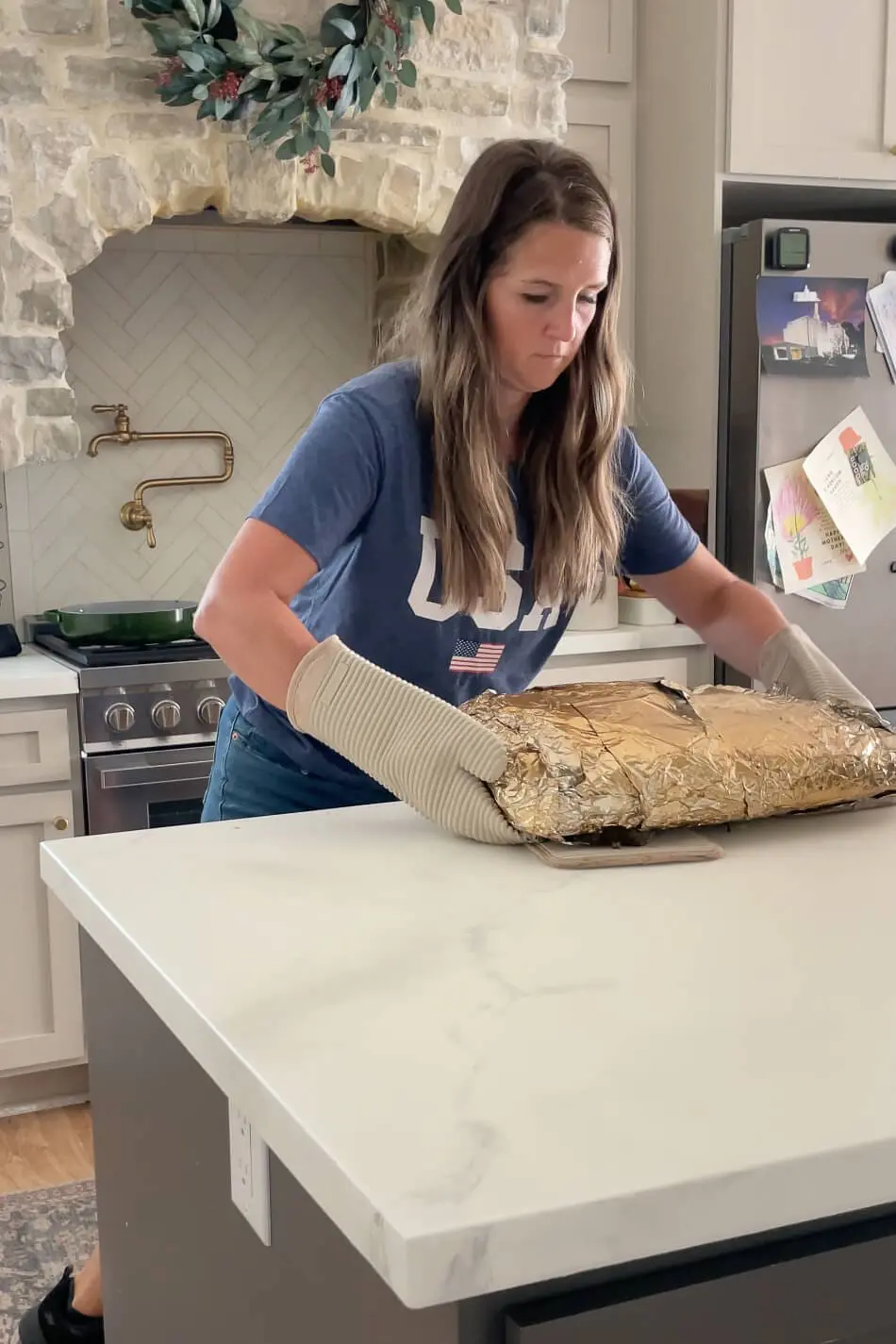 Pulling a brisket out of the smoker.